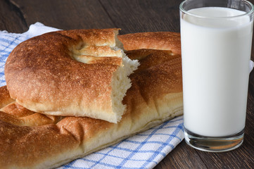 Rustic style. Bread and milk in a glass