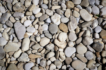 nature background : pebbles texture, rounded stone smoothed by river water
