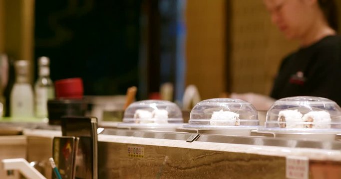Sushi conveyor belt in Japanese sushi restauran