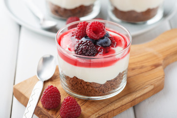 Cheesecake in glass  with fresh raspberries and cream cheese. Healthy homemade organic dessert.