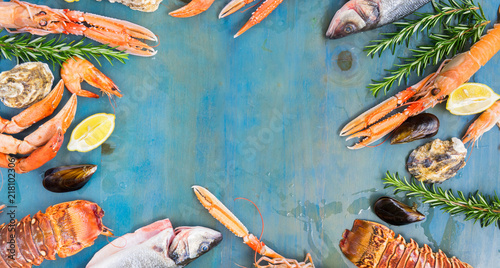 Fresh Seafood And Fish Flat Lay Frame On Blue Wooden Background