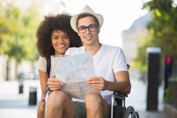 strolling with a man on a wheelchair