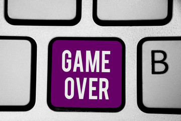 Writing note showing Game Over. Business photo showcasing A situation in a particular sport that reach his finals or ending Keyboard purple key Intention computer computing reflection document.