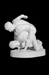 figurine of wrestlers on a black background © Artem Merzlenko