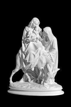 statuette of a religious scene with a baby Jesus