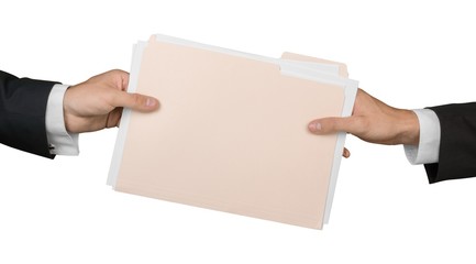 Closeup of Businesspeople Handing File Folder