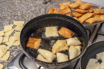 Close-up shot for small turkish pancakes on cook with hot oil