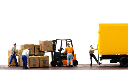 miniature warehouse workers forklift carrying goods box to semi truck with trailer .logistics...
