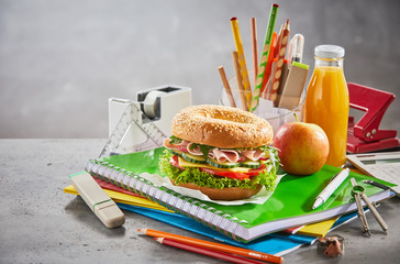 Fresh lunch sandwich with juice on school desk