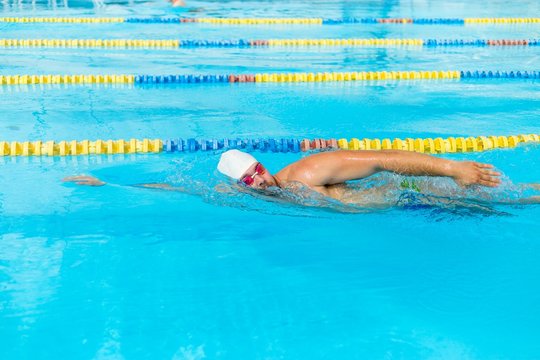 Man swims sidestroke in the pool
