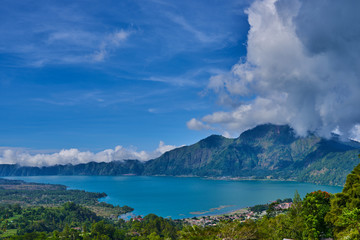 Fototapeta na wymiar Lake Buyan in Bali Island Indonesia - nature travel background. Mountain lake in the central part of Bali island. Beautiful lakes with turquoise water in the mountains. Landscape. Magnificent view.