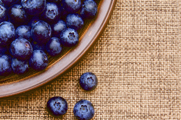 tasty juicy blueberry in a clay plate 