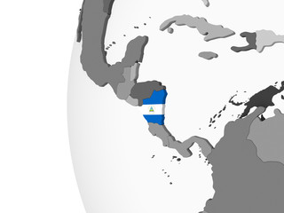 Nicaragua with flag on globe