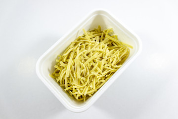 Close-up shot of handmade traditional pasta in white box