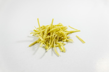 Close-up shot of handmade traditional pasta stack on white background