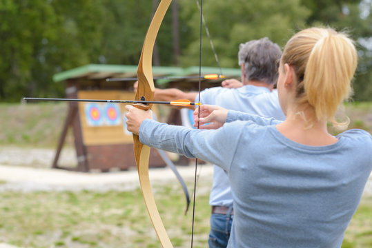 Couple during archery practice