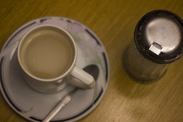 Obraz na płótnie Canvas Coffee cup in a plate with sugar