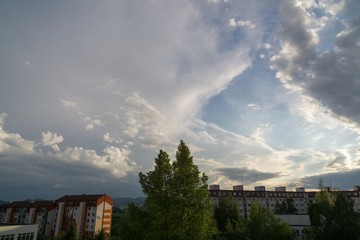 Naklejka na ściany i meble Clouds over the town. Slovakia 