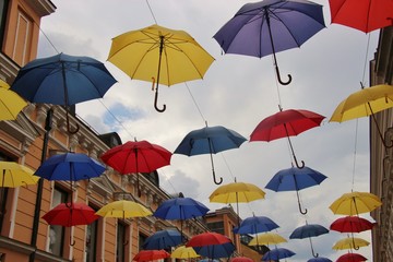 Fototapeta na wymiar Colorful umbrellas in the sky. Seen in the pedestrian zone of Banja Luka, Bosnia and Herzegovina. South-east Europe.