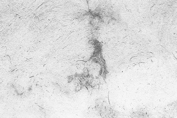 Wall fragment with scratches and cracks