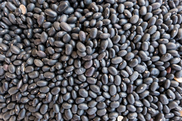 Fresh black bean stand at a street organic food market.