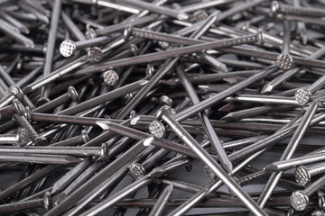  Full frame background showing lots of metallic metal iron nails