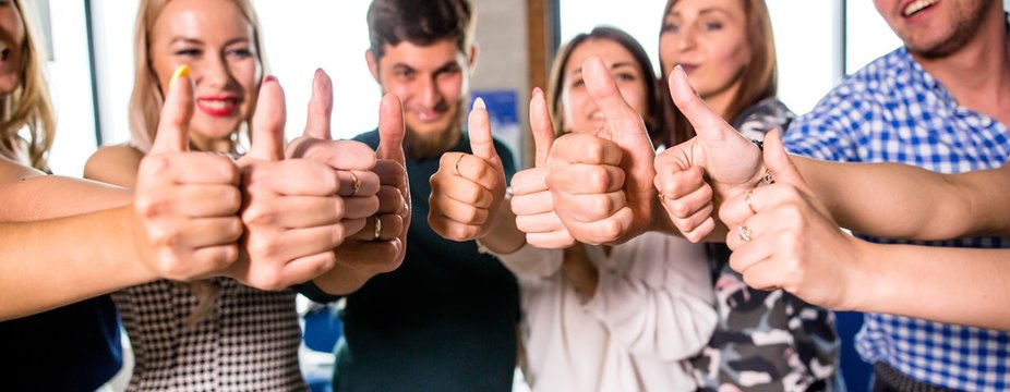 Business people stretched forward their hands gesticulating class lifting his thumb up