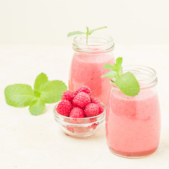 Raspberry smoothie close up photography with fresh summer blended cocktail and ripe berries.