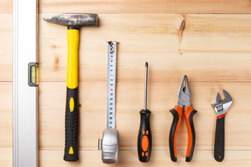 Set of hand tools on wooden table. Instruments on wooden background. Repair tools. Top view. Flat lay. Close-up. Copy space