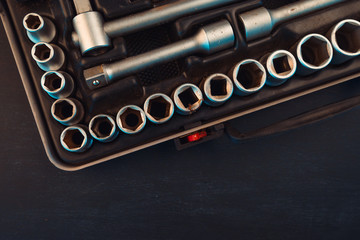 Old used socket tool box with accessories top view