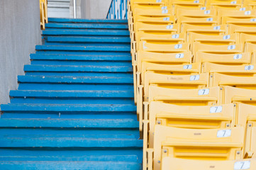 Empty yellow seats at stadium,Rows walkway of seat on a soccer stadium