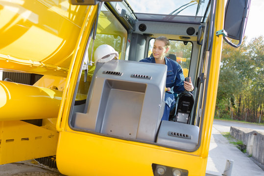 woman worker operating a vehicle