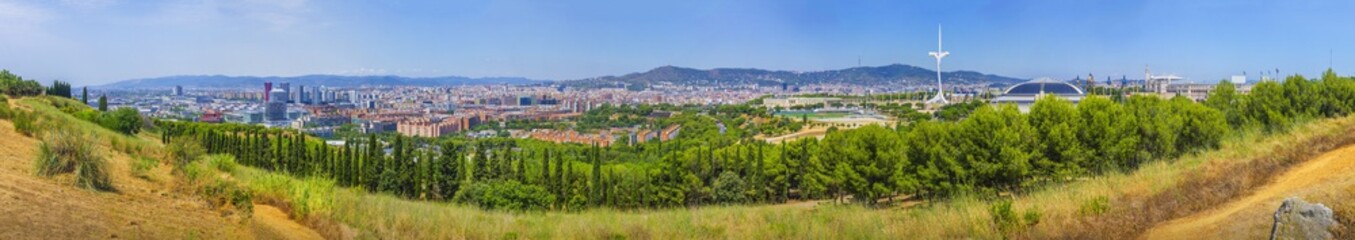 Fototapeta na wymiar Large panorama of Barcelona – beautiful view from Montjuic mountain to Fira, Sants, Olympic buildings