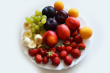 the fruit on the plate, fruit, food, apple, fresh, grape, orange healthy, grapes, fruits, ripe, green, red, isolated, plum, white, strawberry, juicy, diet, sweet, vegetable, cherry, yellow, tropical,