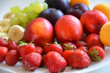 the fruit on the plate, fruit, food, apple, fresh, grape, orange healthy, grapes, fruits, ripe, green, red, isolated, plum, white, strawberry, juicy, diet, sweet, vegetable, cherry, yellow, tropical,