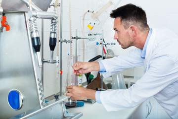 Professional man working with quality tests of wine
