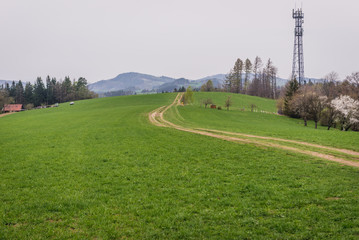 Dust road on a hill in tourist district Beskids - Moravian Wallachia in Czech Republic