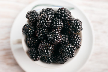 Blackberry berries close-up on a white background, top view