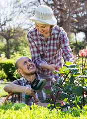 Senior couple working in the garden.