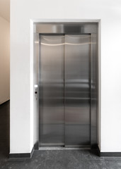 Modern elevator in apartment building, New elevator in operation, European modern stainless steel elevator in block of flats - 218125938