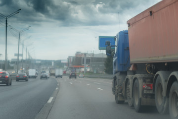 big dump truck goes in the evening on highway