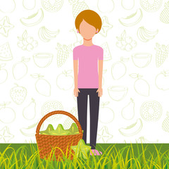 woman with basket full carambola in the grass