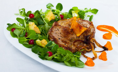 Grilled pork chop with greens and squash puree