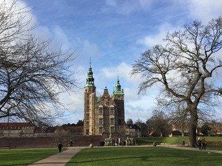 Fototapeta na wymiar Rosenborg Castle Gardens in Copenhagen, Denmark. Sunny winter day view. The castle was originally built as a country summerhouse in 1606.