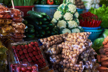 Vegetables at asian street market. Fresh and organic vegetables for sale. Farmers markets are a traditional way of selling agricultural products. Autumn harvest. Healthy organic food concept.