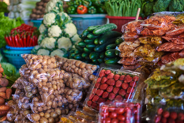 Farmer's fresh vegetables. Different fresh colorful vegetables selling at asian street market. Many different ripe vegetables healthy vegetarian eating. Healthy organic food concept. Selective focus.