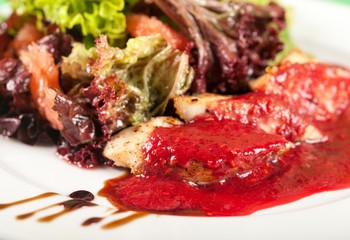 Closeup of a Salad with Chicken and Red Sauce