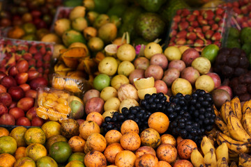 Asian farm market, fresh colorful ripe fruit and vegetables  Different fresh farm fruit and vegetables. Autumn harvest and healthy organic food concept.
