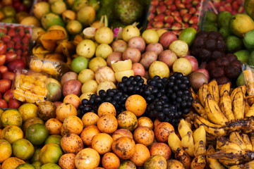 Asian farm market, fresh colorful ripe fruit and vegetables  Different fresh farm fruit and vegetables. Autumn harvest and healthy organic food concept.