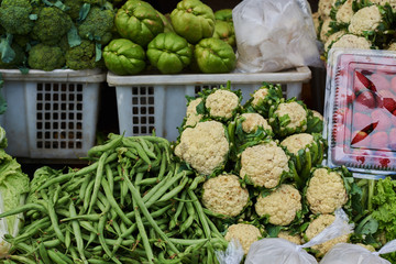 Fresh green vegetables for selling in the market. Various vegetables on market in Asia. Selective focus.